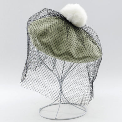 Elegant wool beret with mesh veil